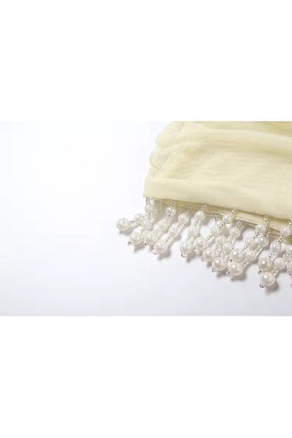 Mirae Paris butter yellow mini dress with pearl and bead fringe detail. Soft, feminine, and elegant.