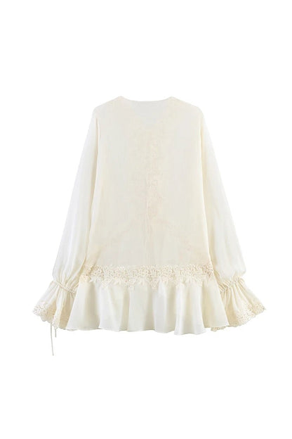 Miraee Paris semi-transparent cream lace blouse with V-neck, ruffled sleeves, and delicate embroidery details.