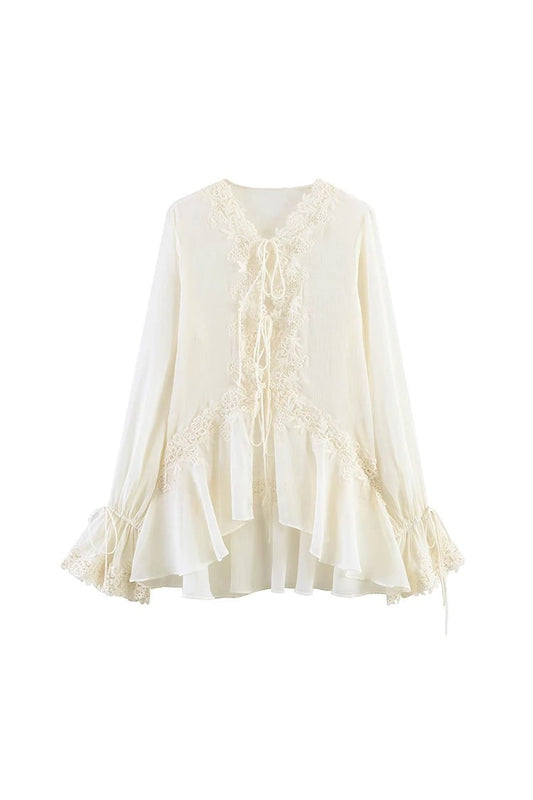 Miraee Paris semi-transparent cream lace blouse with V-neck, tie-front detail, and romantic ruffled sleeves.