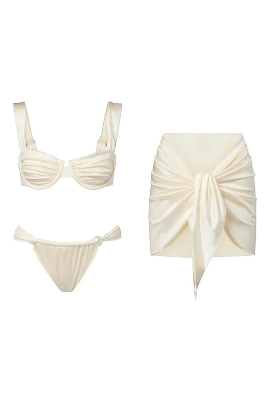 Miraee Paris Emma Pearl bikini set in cream with underwire top, pearl-accented bottoms, and a matching tie-front skirt.