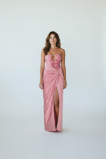 Miraee Paris Lara pink one-piece swimsuit with ruffled neckline and matching floor-length wrap cover-up skirt.