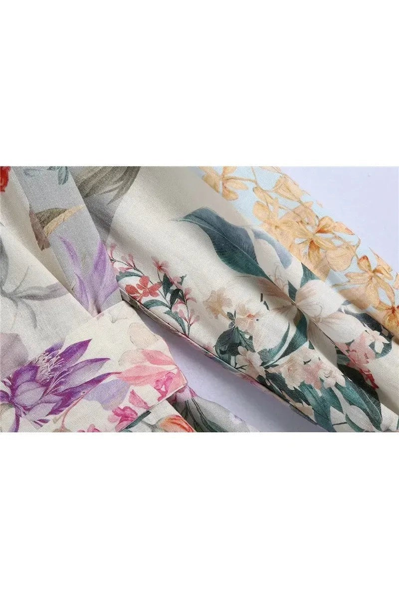 Miraee Paris Lena floral mini dress featuring a vintage-inspired botanical print with purple and yellow flowers.