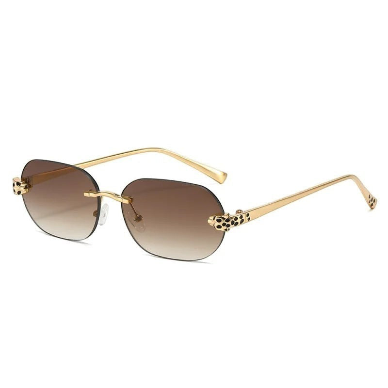 Miraee Paris rimless sunglasses with brown gradient lenses, gold metal frames, and cheetah-inspired side decorations.